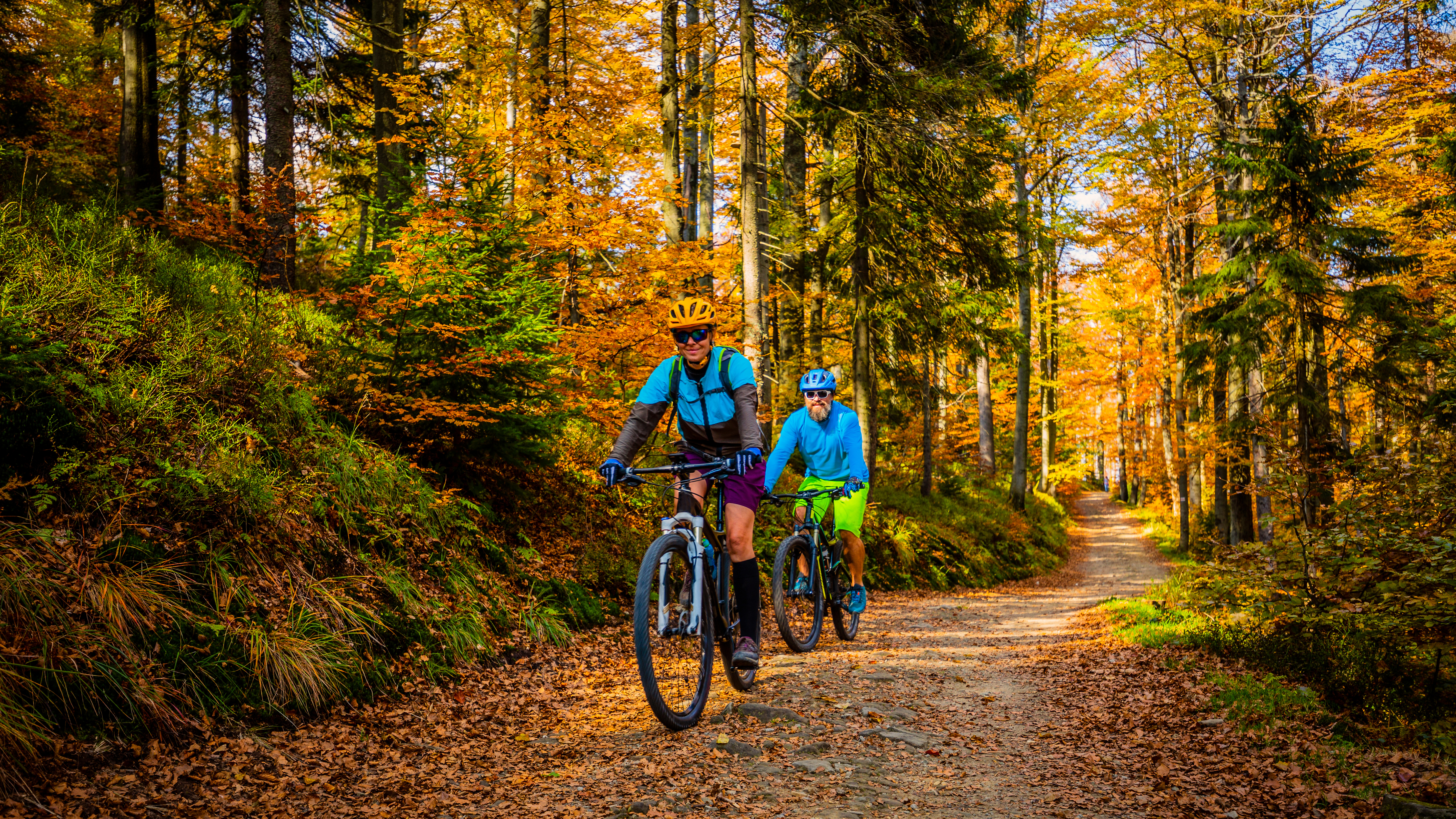 older folks riding bikes on the trail